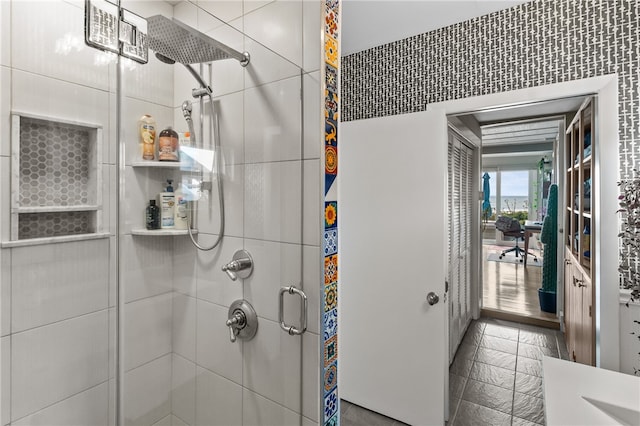 bathroom featuring a shower with door