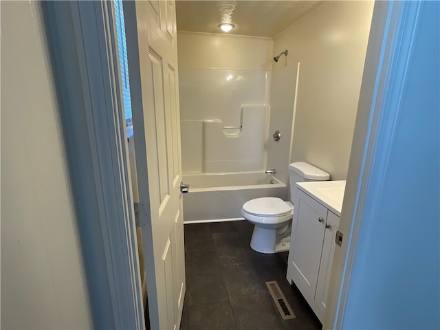 full bathroom featuring vanity, toilet, tile patterned flooring, and shower / washtub combination