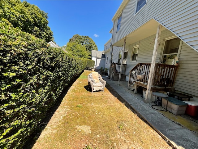 view of yard featuring covered porch