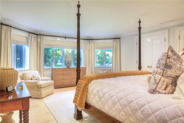 bedroom featuring light hardwood / wood-style floors and ornamental molding