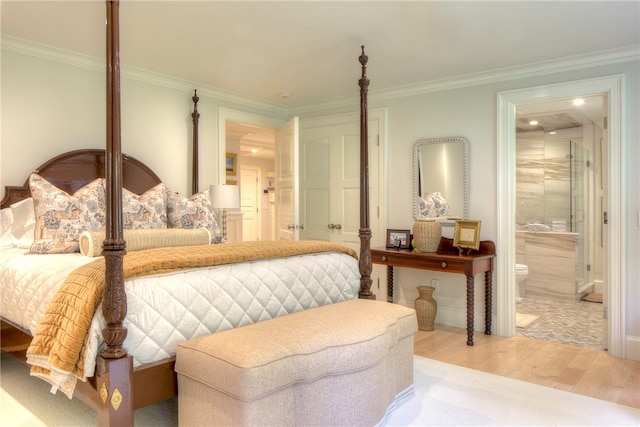 bedroom with ornamental molding, light hardwood / wood-style flooring, and ensuite bathroom