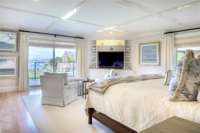 bedroom with coffered ceiling and hardwood / wood-style flooring