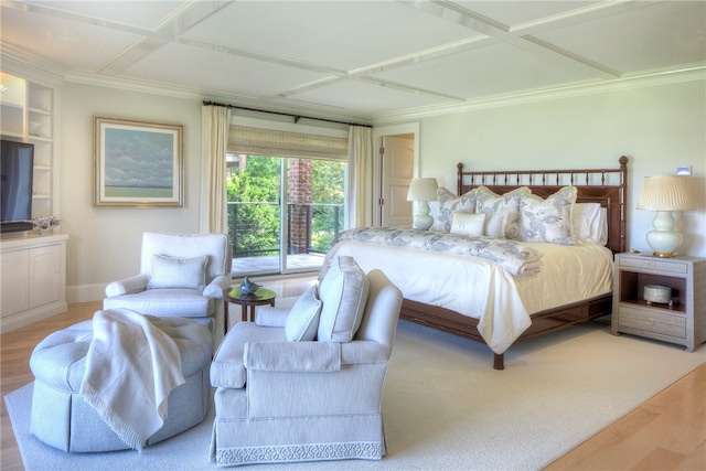 bedroom featuring hardwood / wood-style floors, coffered ceiling, and crown molding