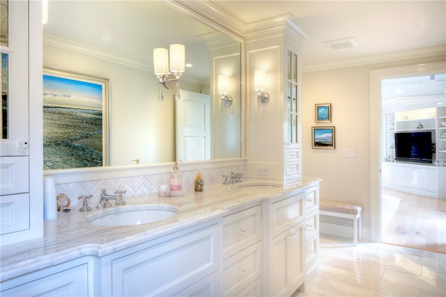 bathroom featuring vanity, hardwood / wood-style flooring, and ornamental molding