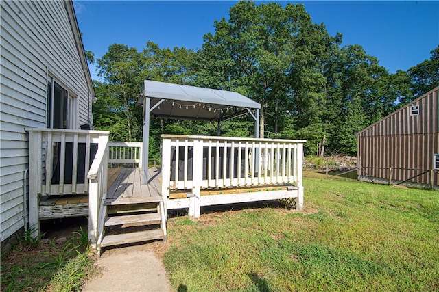 view of yard featuring a wooden deck and a gazebo