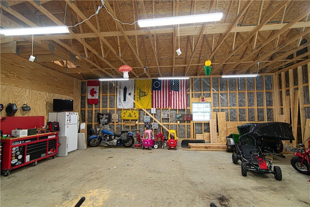 garage with white fridge