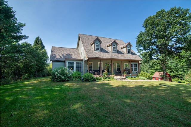 view of front facade with a front yard and a porch