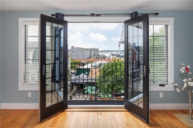 doorway with hardwood / wood-style flooring