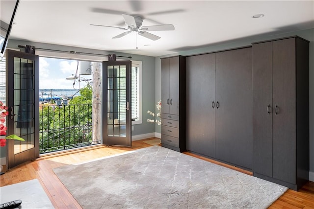 unfurnished bedroom featuring wood finished floors and baseboards