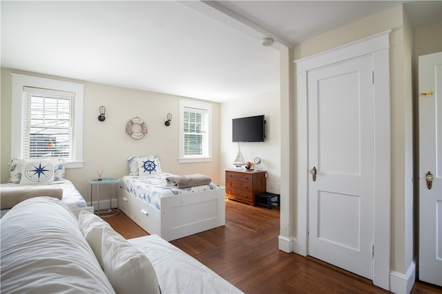 bedroom featuring dark wood-type flooring