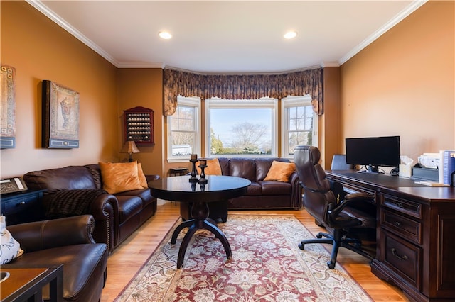 home office with light wood-type flooring and crown molding