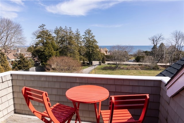 balcony featuring a water view