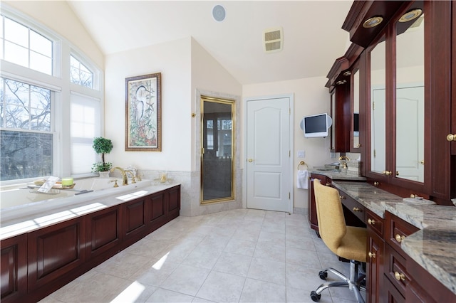 bathroom featuring vanity, shower with separate bathtub, lofted ceiling, and tile patterned flooring