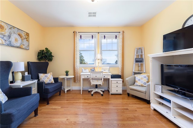 office with light hardwood / wood-style floors