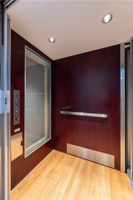 interior space featuring hardwood / wood-style floors and elevator