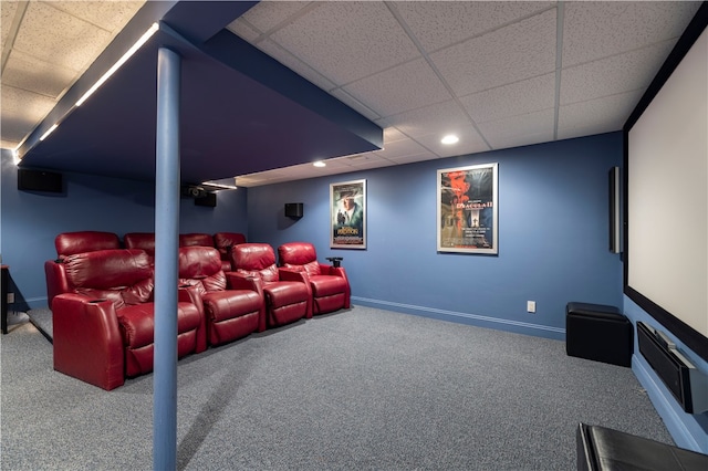 home theater room with carpet floors and a paneled ceiling