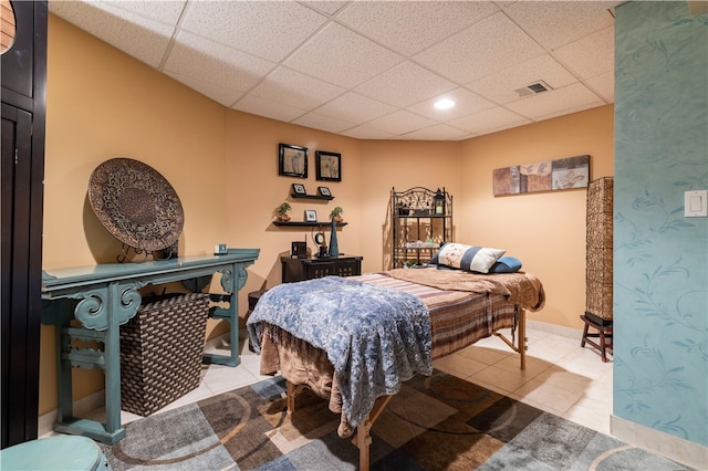 tiled bedroom with a drop ceiling