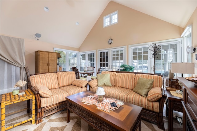 living room with high vaulted ceiling