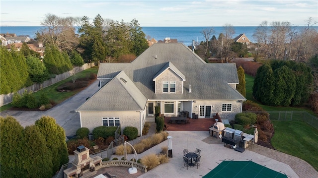 exterior space with a patio and a water view