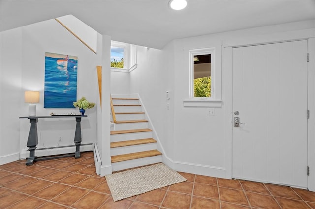 tiled foyer featuring a baseboard radiator