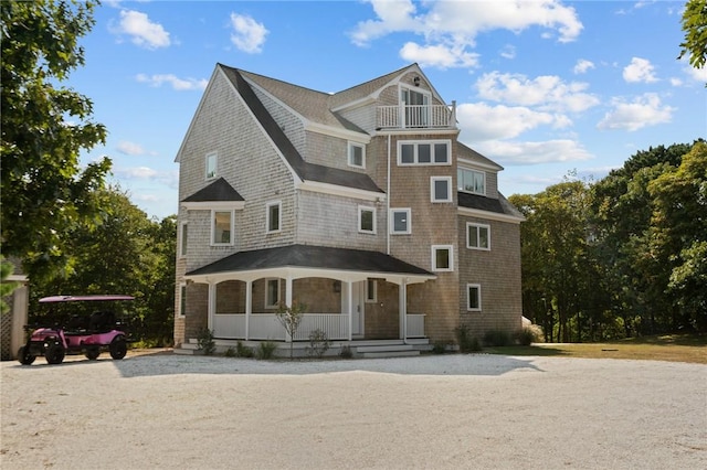 view of front of house featuring a porch and a balcony