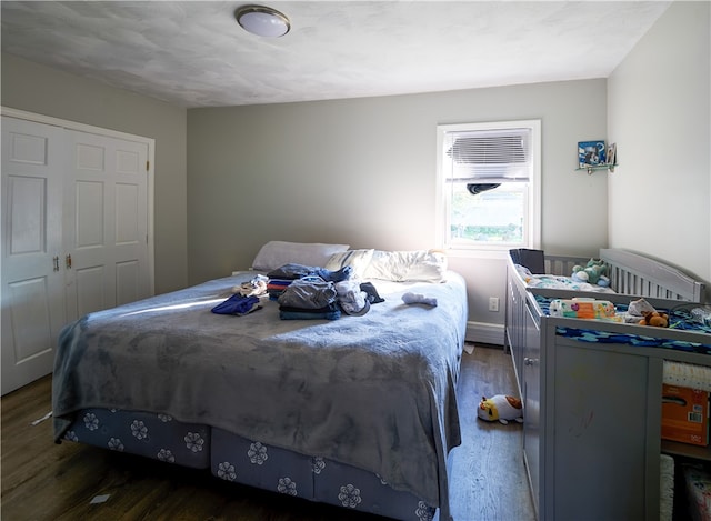 bedroom with dark wood-type flooring