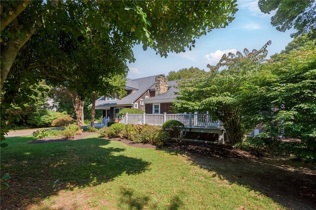 view of yard featuring a wooden deck