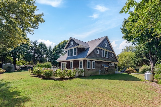 view of side of property with a lawn