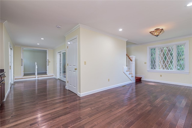 empty room with ornamental molding and dark hardwood / wood-style flooring