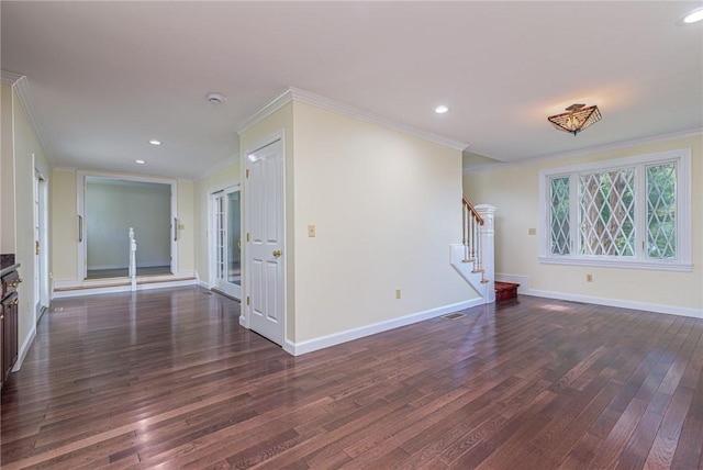 unfurnished living room with dark wood finished floors, recessed lighting, baseboards, ornamental molding, and stairway