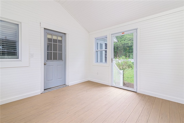 unfurnished sunroom with vaulted ceiling