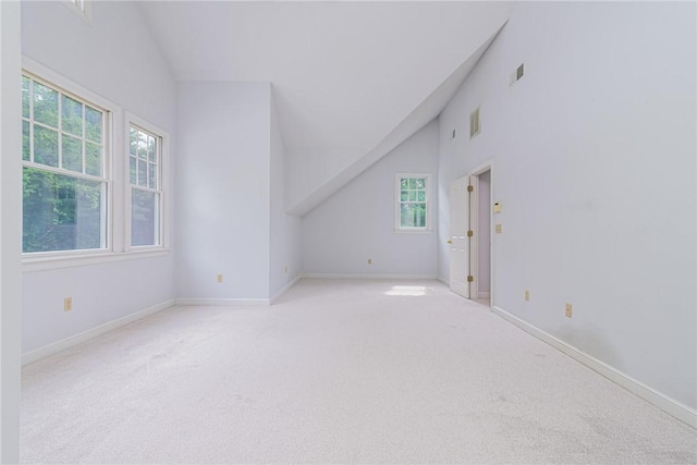 bonus room featuring carpet flooring, baseboards, and lofted ceiling