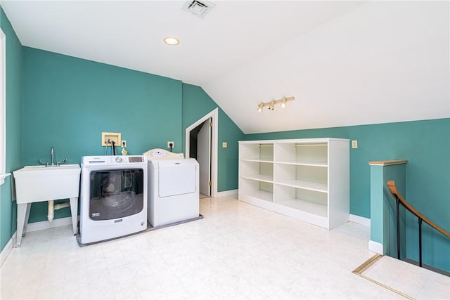 clothes washing area with laundry area, tile patterned floors, baseboards, visible vents, and washing machine and dryer