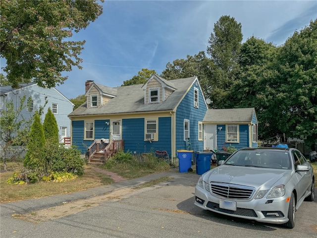 view of new england style home