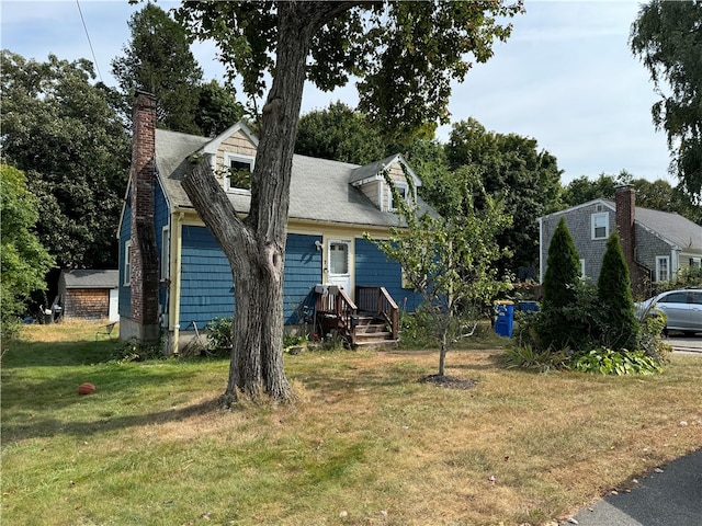 view of front of home with a front yard