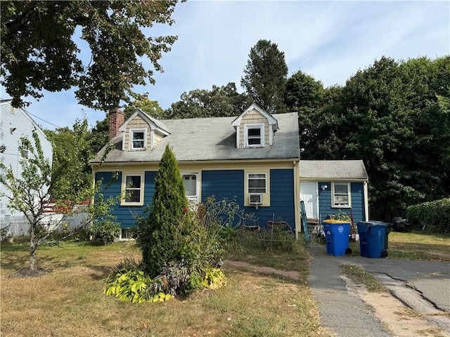 new england style home featuring cooling unit