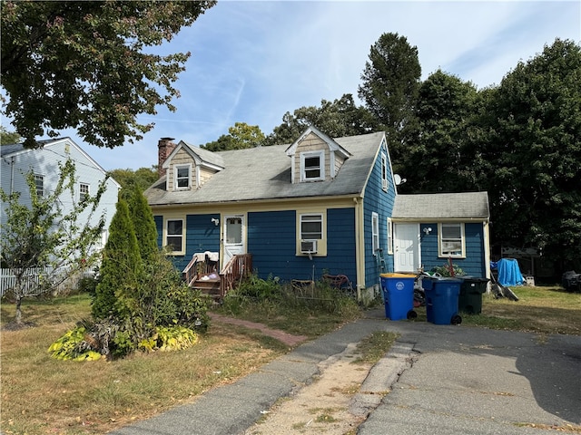 cape cod house with cooling unit