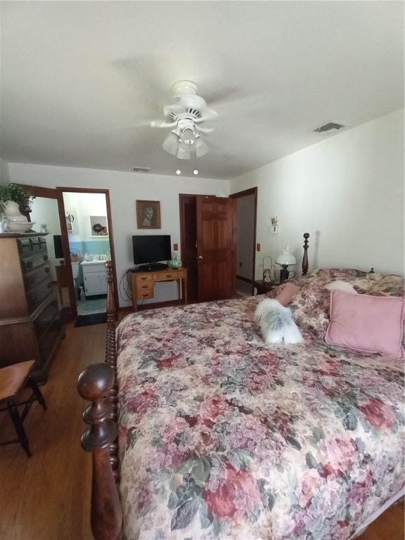 bedroom with ceiling fan and hardwood / wood-style flooring