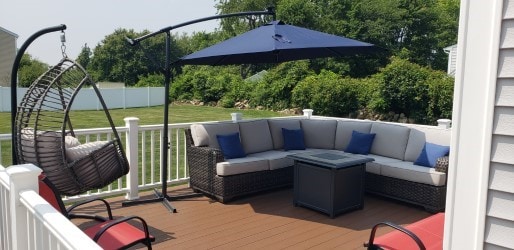 deck featuring outdoor lounge area and a yard