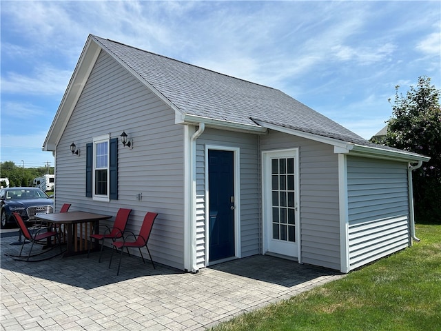 back of property with a patio