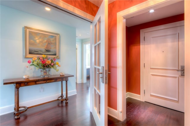 hallway with french doors and dark wood-type flooring