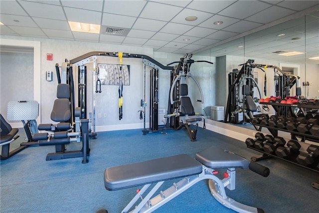 workout area featuring a drop ceiling