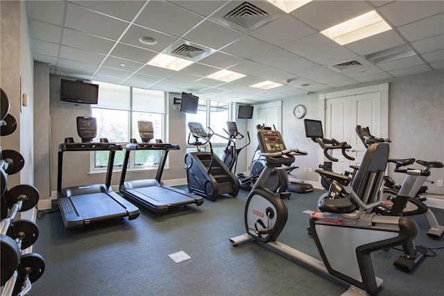 gym featuring a paneled ceiling