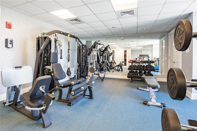 workout area with a paneled ceiling