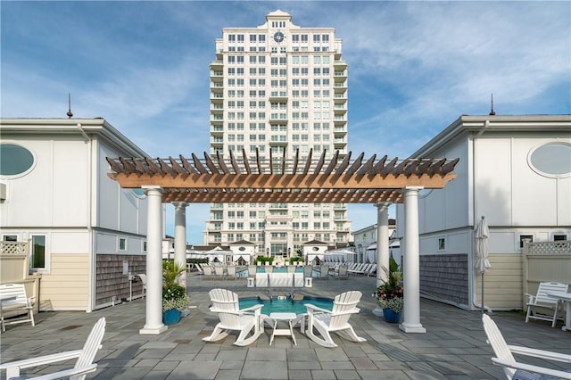 view of patio featuring a pergola and a swimming pool