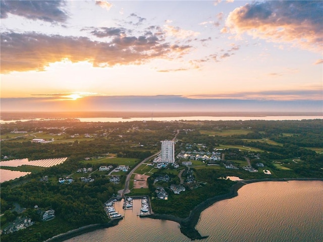 aerial view at dusk with a water view