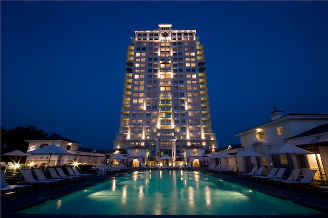 view of pool at night