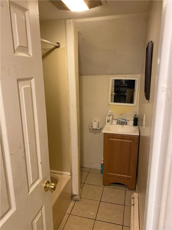 bathroom featuring vanity and tile patterned flooring