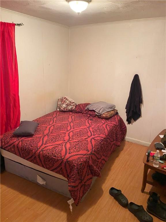 bedroom featuring wood-type flooring