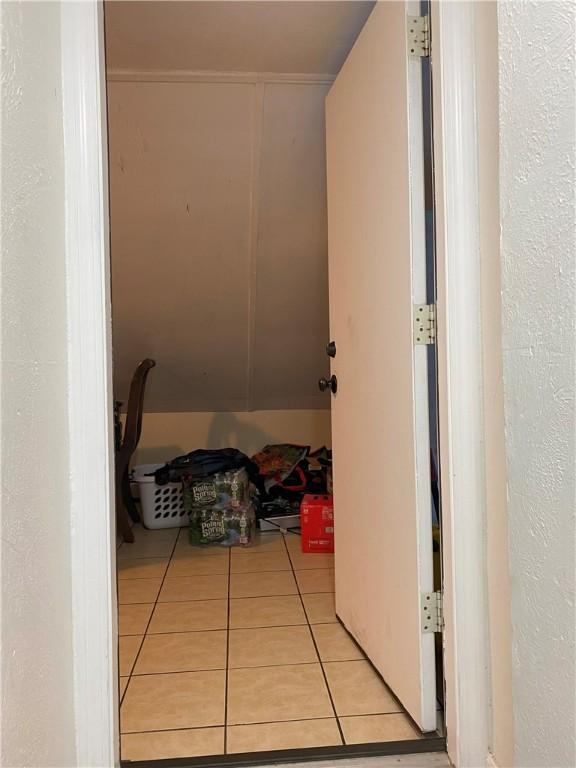 hallway with light tile patterned floors